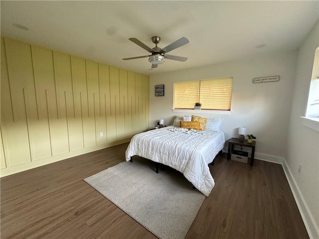 839 Behrman Ave, New Orleans, LA 70114 - bedroom with baseboards, wood finished floors, a ceiling fan, and multiple windows