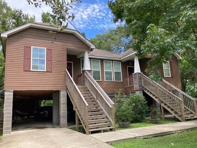 516-518 Erlanger Ave, Slidell, LA 70458 - coastal home featuring stairway and a carport