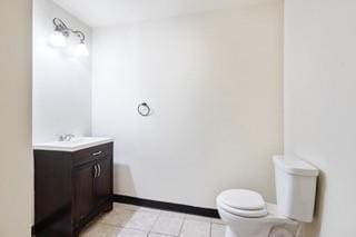 1700 S Rampart St, New Orleans, LA 70113 - bathroom featuring toilet, tile patterned floors, vanity, and baseboards
