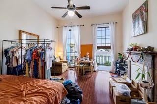 1700 S Rampart St, New Orleans, LA 70113 - bedroom with wood finished floors, access to exterior, and a ceiling fan