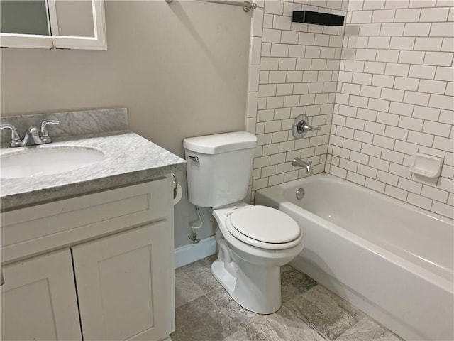 full bathroom featuring toilet, vanity, bathtub / shower combination, and baseboards