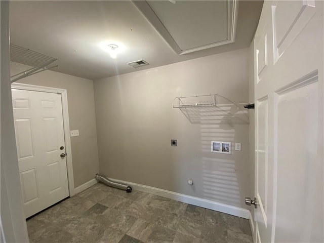 clothes washing area with gas dryer hookup, hookup for a washing machine, electric dryer hookup, and baseboards