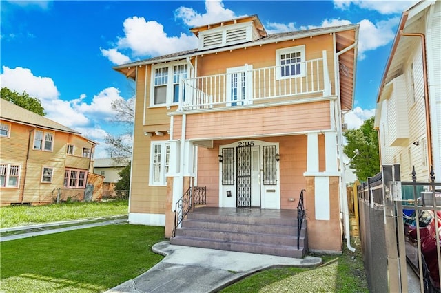 2315 Peniston St, New Orleans, LA 70115 - view of front facade featuring a balcony and a porch