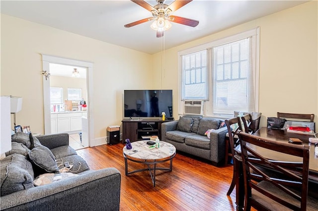 2315 Peniston St, New Orleans, LA 70115 - living area featuring hardwood / wood-style flooring, ceiling fan, and cooling unit