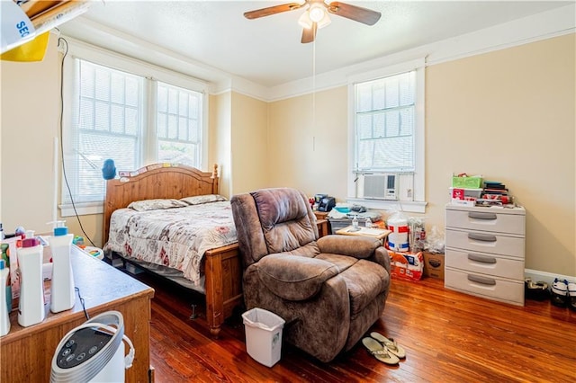 2315 Peniston St, New Orleans, LA 70115 - bedroom featuring hardwood / wood-style flooring, cooling unit, and ceiling fan