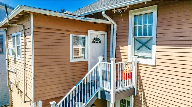 2315 Peniston St, New Orleans, LA 70115 - view of exterior entry featuring roof with shingles