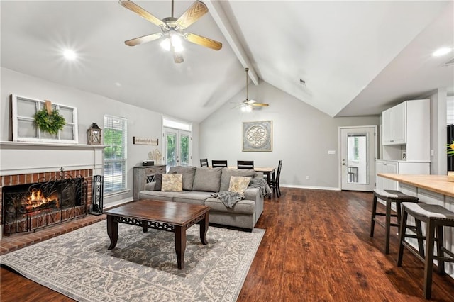 20035 River Parc Dr, Covington, LA 70433 - living area with ceiling fan, a brick fireplace, dark wood-style floors, and baseboards