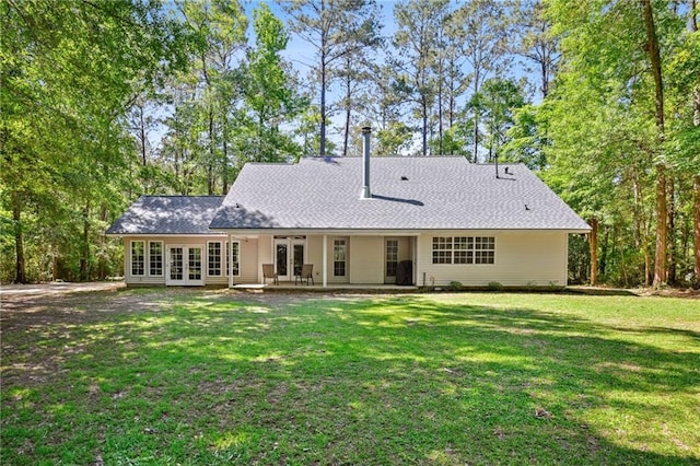 20035 River Parc Dr, Covington, LA 70433 - rear view of house with french doors, a lawn, and a patio area