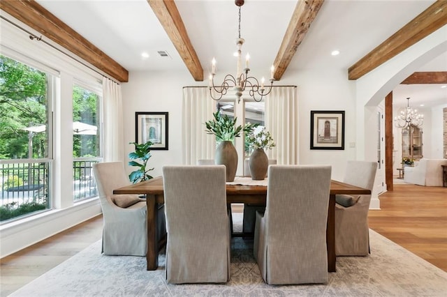 474 Trailhead Dr, Abita Springs, LA 70420 - dining room featuring a chandelier, wood finished floors, arched walkways, beam ceiling, and recessed lighting