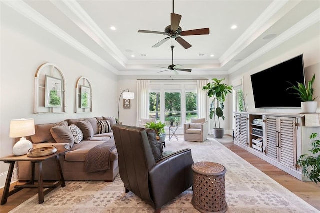 474 Trailhead Dr, Abita Springs, LA 70420 - living room with a tray ceiling, a ceiling fan, wood finished floors, and crown molding