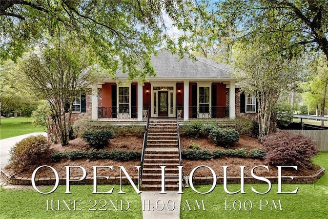 740 Double J Rd, Covington, LA 70433 - view of front of property with a porch, stairway, a front yard, and a shingled roof