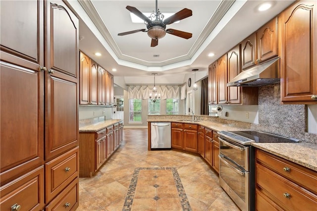 740 Double J Rd, Covington, LA 70433 - kitchen featuring stainless steel appliances, under cabinet range hood, a raised ceiling, ceiling fan, and ornamental molding