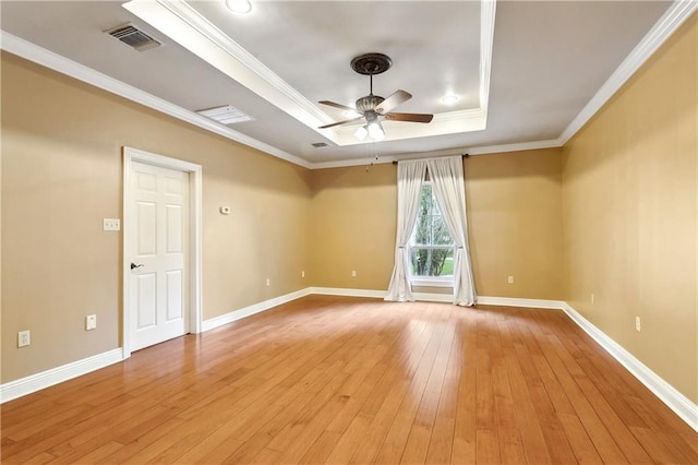 740 Double J Rd, Covington, LA 70433 - empty room featuring a raised ceiling, ceiling fan, light wood-style flooring, and crown molding