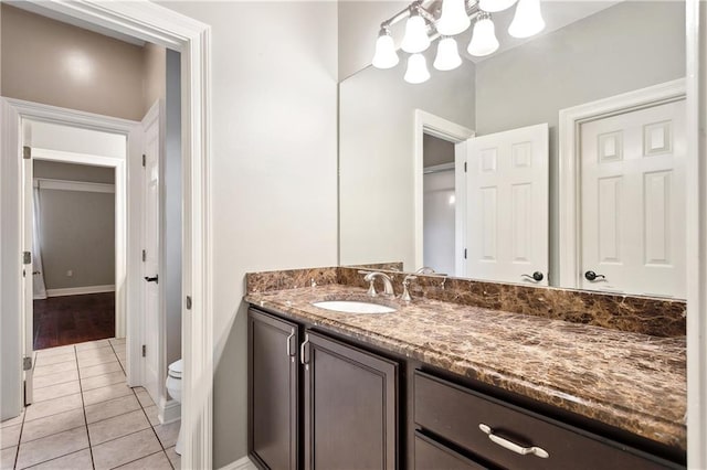 740 Double J Rd, Covington, LA 70433 - bathroom featuring vanity, tile patterned floors, and a chandelier
