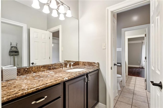 740 Double J Rd, Covington, LA 70433 - bathroom with tile patterned flooring, vanity, and a chandelier