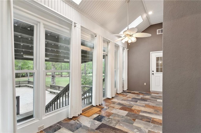 740 Double J Rd, Covington, LA 70433 - unfurnished sunroom with a skylight and vaulted ceiling