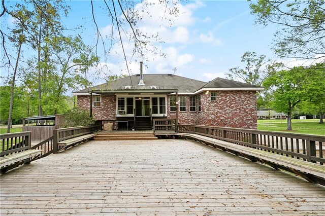 740 Double J Rd, Covington, LA 70433 - deck featuring a sunroom and driveway