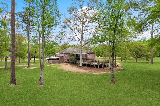 740 Double J Rd, Covington, LA 70433 - view of green lawn with a deck