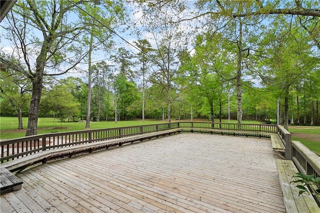 740 Double J Rd, Covington, LA 70433 - wooden deck featuring view of scattered trees and a yard