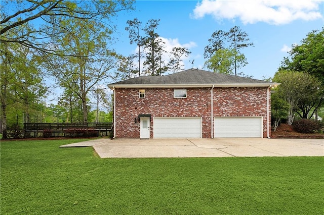 740 Double J Rd, Covington, LA 70433 - view of home's exterior featuring a lawn, brick siding, a garage, and driveway
