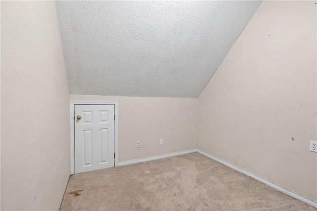 116 Fay Way, Slidell, LA 70460 - additional living space with carpet, a textured ceiling, lofted ceiling, and baseboards