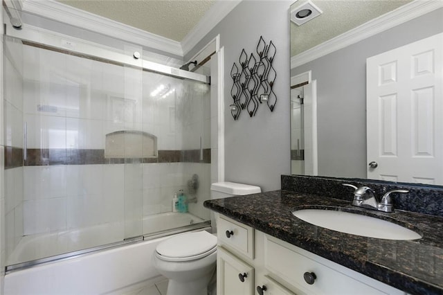 1332 Denmark Ct, Slidell, LA 70461 - bathroom featuring toilet, vanity, a textured ceiling, ornamental molding, and combined bath / shower with glass door