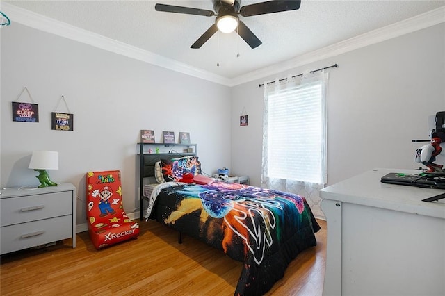 1332 Denmark Ct, Slidell, LA 70461 - bedroom with light wood-style flooring, crown molding, ceiling fan, and baseboards