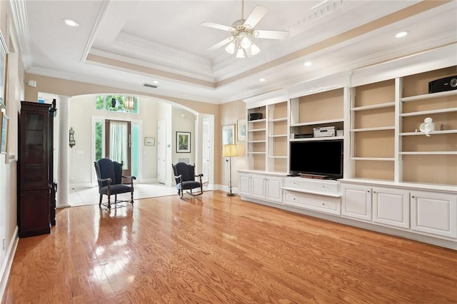 1203 W Cherry Hill Loop, Folsom, LA 70437 - living area with arched walkways, ornate columns, baseboards, a ceiling fan, and light wood finished floors