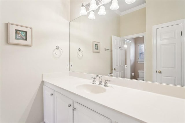 1203 W Cherry Hill Loop, Folsom, LA 70437 - bathroom with toilet, vanity, a chandelier, and ornamental molding