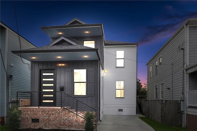 172224 St Ann St, New Orleans, LA 70116 - modern home with crawl space, board and batten siding, and fence