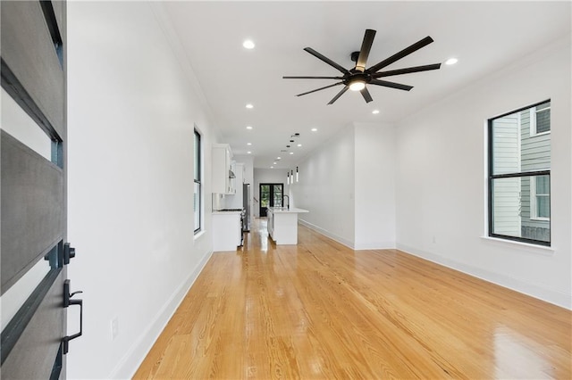 172224 St Ann St, New Orleans, LA 70116 - unfurnished living room featuring recessed lighting, a ceiling fan, light wood-style flooring, ornamental molding, and baseboards