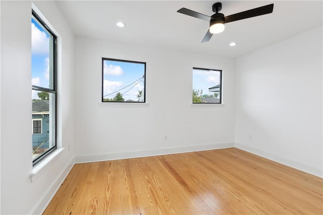 172224 St Ann St, New Orleans, LA 70116 - empty room with healthy amount of natural light, light wood finished floors, baseboards, and recessed lighting