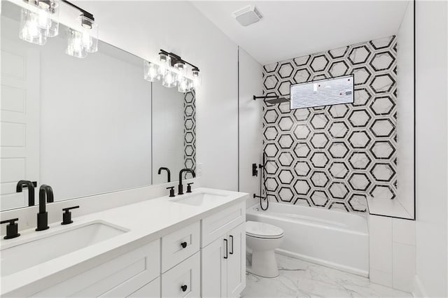 172224 St Ann St, New Orleans, LA 70116 - full bathroom with marble finish floors, toilet, double vanity, and tub / shower combination