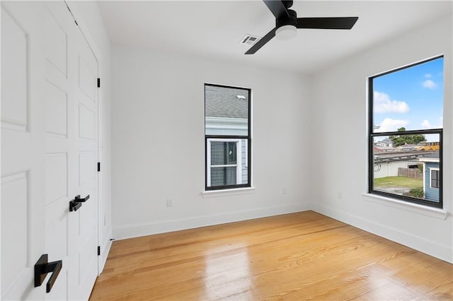 172224 St Ann St, New Orleans, LA 70116 - unfurnished bedroom with baseboards, light wood-style flooring, and a ceiling fan