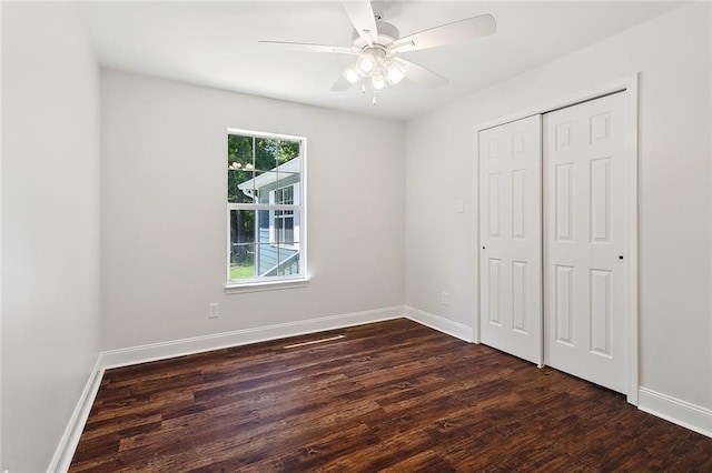 113 Roger Storme Rd, Madisonville, LA 70447 - unfurnished bedroom featuring dark wood-style floors, baseboards, and a closet