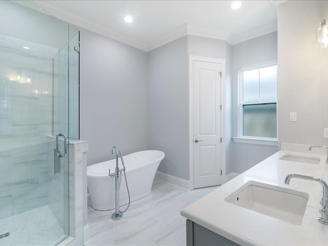 bathroom with a freestanding tub, a shower stall, ornamental molding, recessed lighting, and baseboards