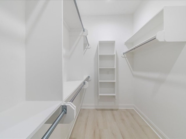 walk in closet featuring light wood-type flooring