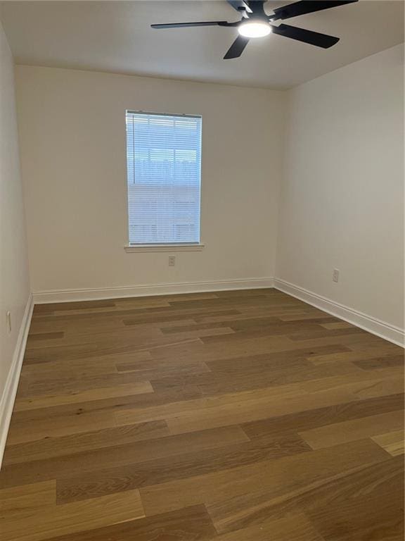 1819 Baronne St, New Orleans, LA 70113 - unfurnished room with ceiling fan, wood finished floors, and baseboards