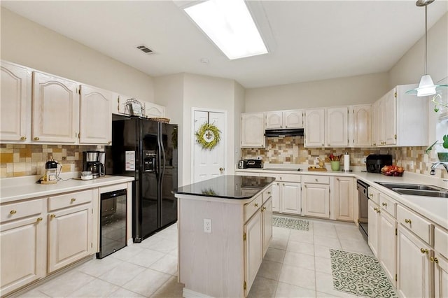 3 Lake Lynn Dr, Harvey, LA 70058 - kitchen with a sink, black appliances, beverage cooler, and tasteful backsplash