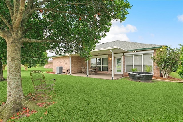 3 Lake Lynn Dr, Harvey, LA 70058 - rear view of house featuring central air condition unit, a patio area, and a yard