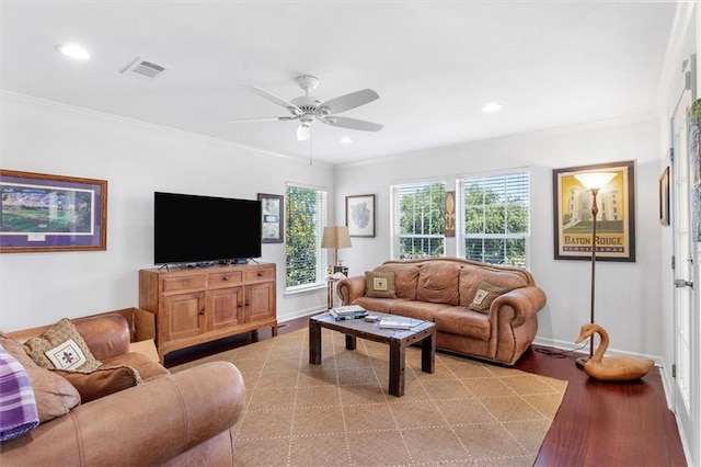 living room with wood finished floors, ceiling fan, ornamental molding, baseboards, and recessed lighting