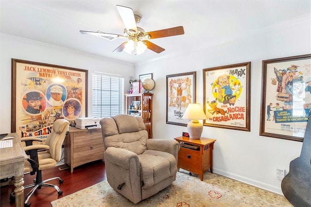office area featuring crown molding, a ceiling fan, wood finished floors, and baseboards