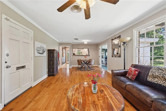 5139 Pratt Dr, New Orleans, LA 70122 - living room featuring light wood finished floors, a ceiling fan, baseboards, and ornamental molding