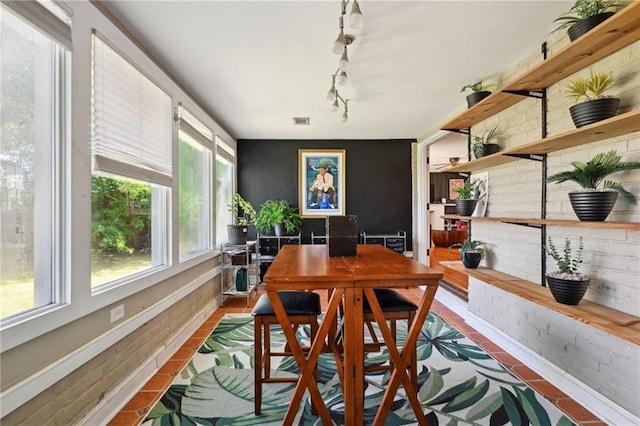 5139 Pratt Dr, New Orleans, LA 70122 - dining space featuring healthy amount of natural light, an office area, and rail lighting