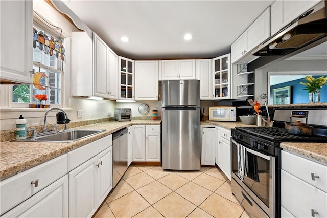 5139 Pratt Dr, New Orleans, LA 70122 - kitchen featuring stainless steel appliances, a sink, light countertops, white cabinetry, and recessed lighting