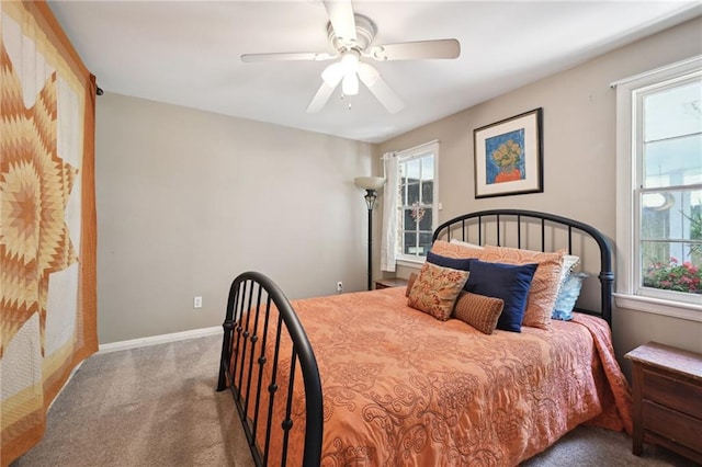 5139 Pratt Dr, New Orleans, LA 70122 - bedroom featuring carpet, multiple windows, baseboards, and ceiling fan