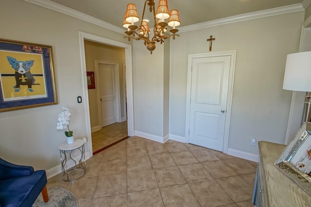 dining room featuring crown molding, a chandelier, light tile patterned floors, and baseboards