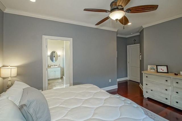bedroom with recessed lighting, wood finished floors, crown molding, baseboards, and connected bathroom