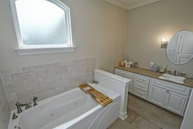 full bathroom featuring a tub with jets, vanity, and tile patterned flooring