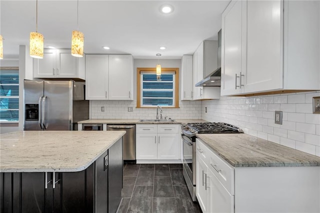 401 Riverdale Dr, Jefferson, LA 70121 - kitchen with stainless steel appliances, a sink, light stone counters, white cabinetry, and recessed lighting